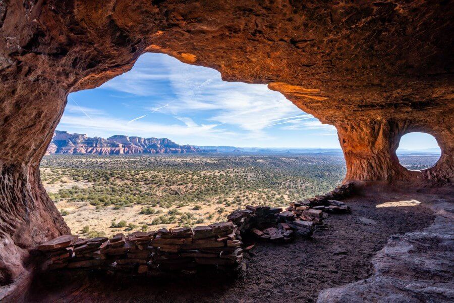 Robbers Roost Trail in northwest Sedona leads to one of the most picturesque caves in Sedona called Hideout Cave with one large window and one small window