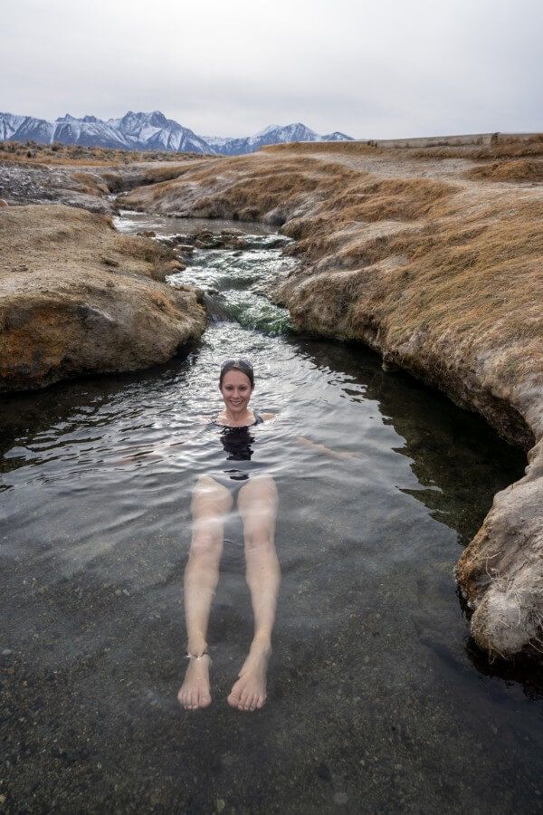 A woman submerged in a hot spring