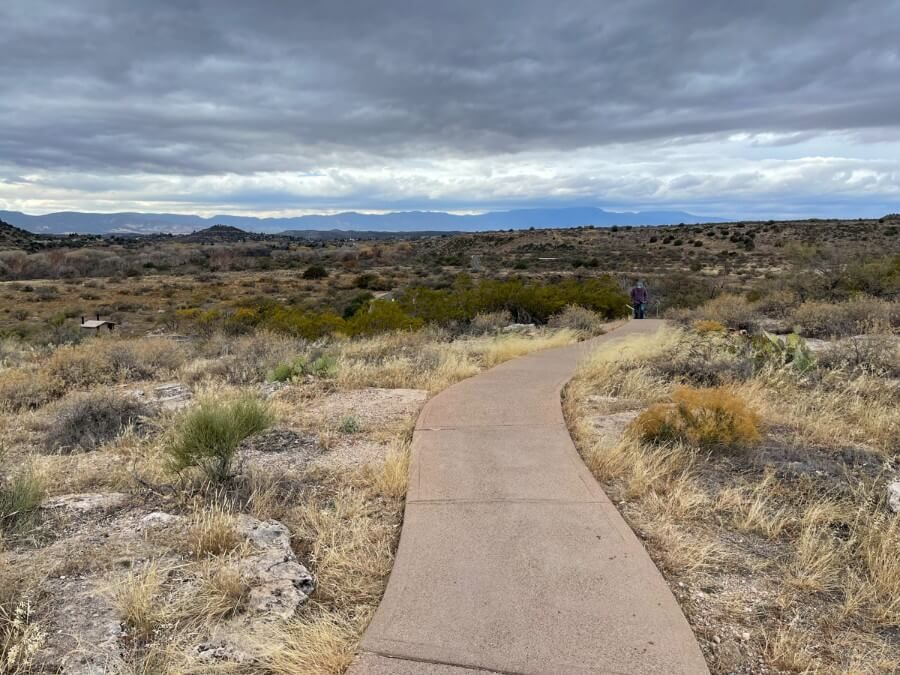 A short trail with a beautiful desert landscape in the distance