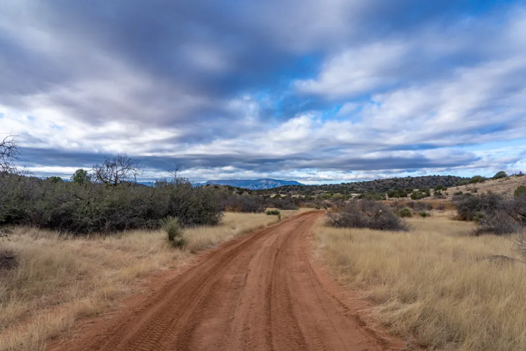 Dirt road and cloudy sky in rural arizona