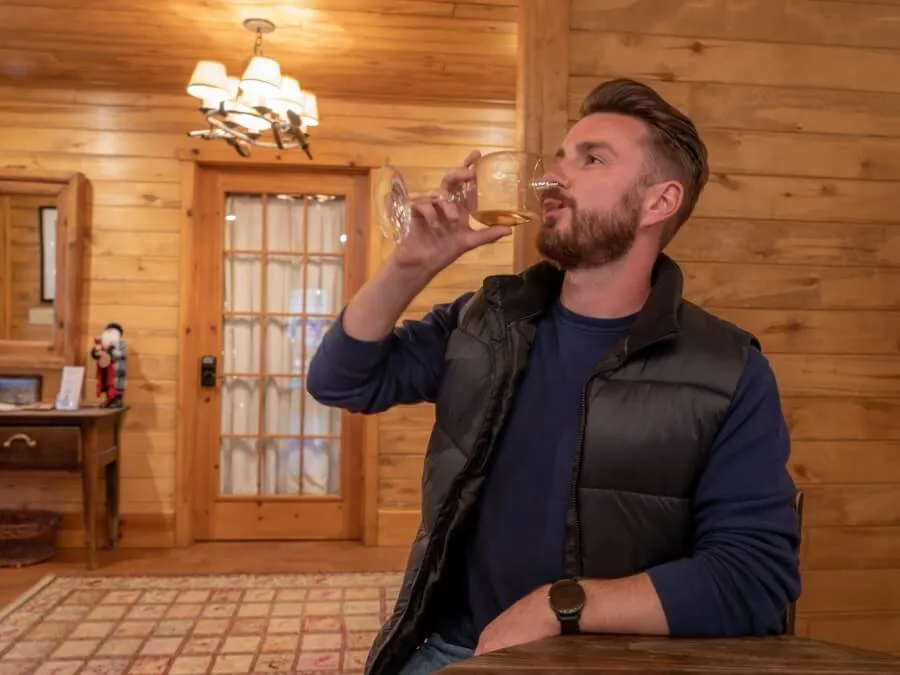 Man enjoying a glass of red wine on the verde valley wine trail