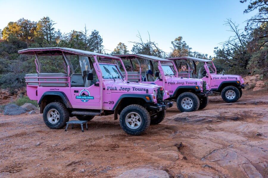 Three pink jeeps parking in a row in Sedona, Arizona