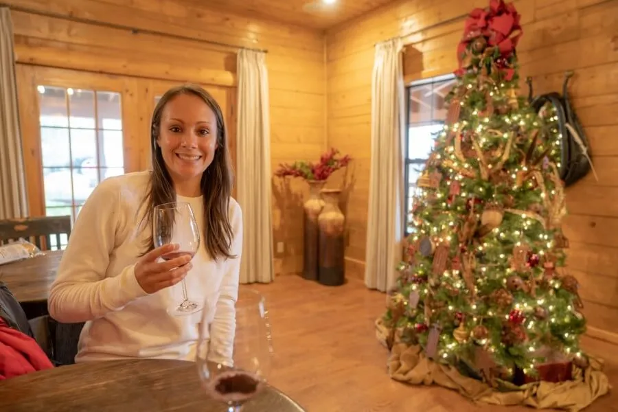 Woman enjoying  a glass of wine in Sedona during Christmas time