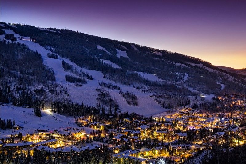 Ski resort Vail in Colorado at night with town lit up one of the top ski destinations in the USA