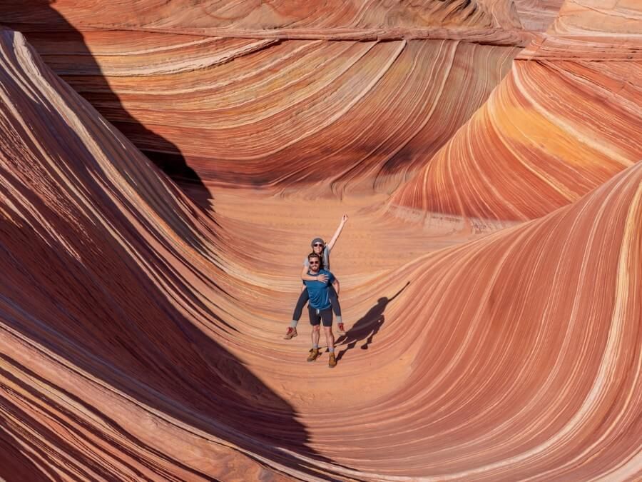 Man and woman hiking the wave in Arizona
