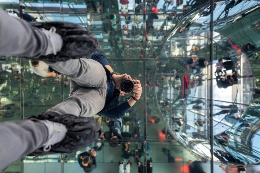 Man taking a photo in the mirrors at Summit One Vanderbuilt