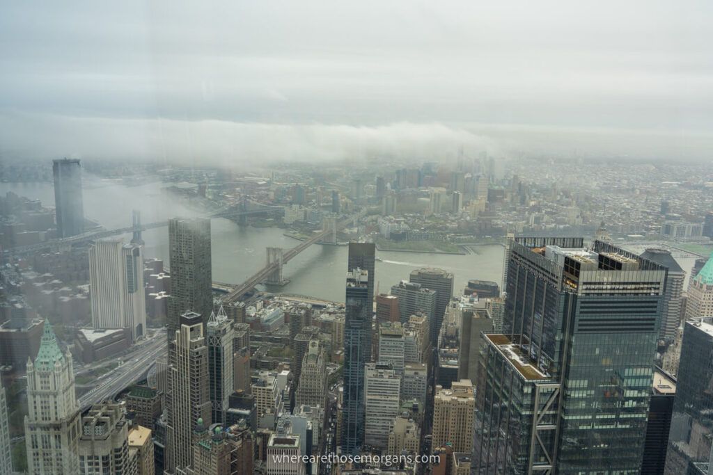Cloudy view of the Manhattan and Brooklyn Bridge from high in an New York observation deck