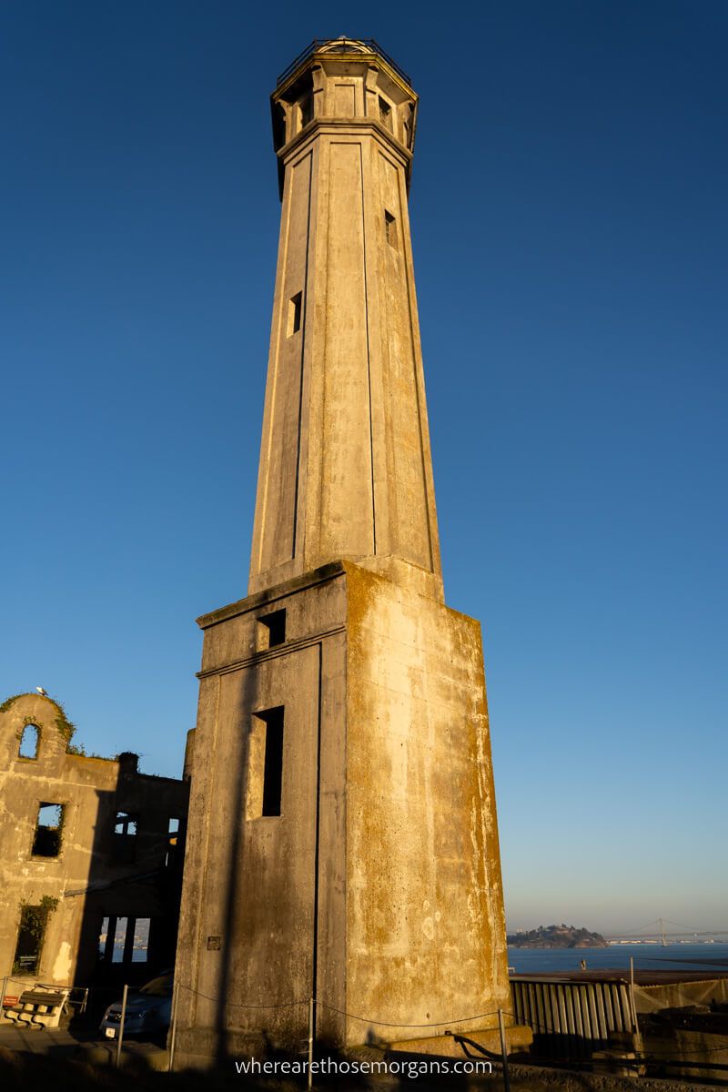 Close up view of the Alcatraz Lighthouse as the sun sets in the San Francisco Bay