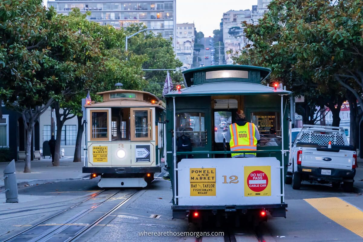 Cable Cars in San Francisco one of the most iconic cheap things to do in SF two cars on parallel tracks at dusk