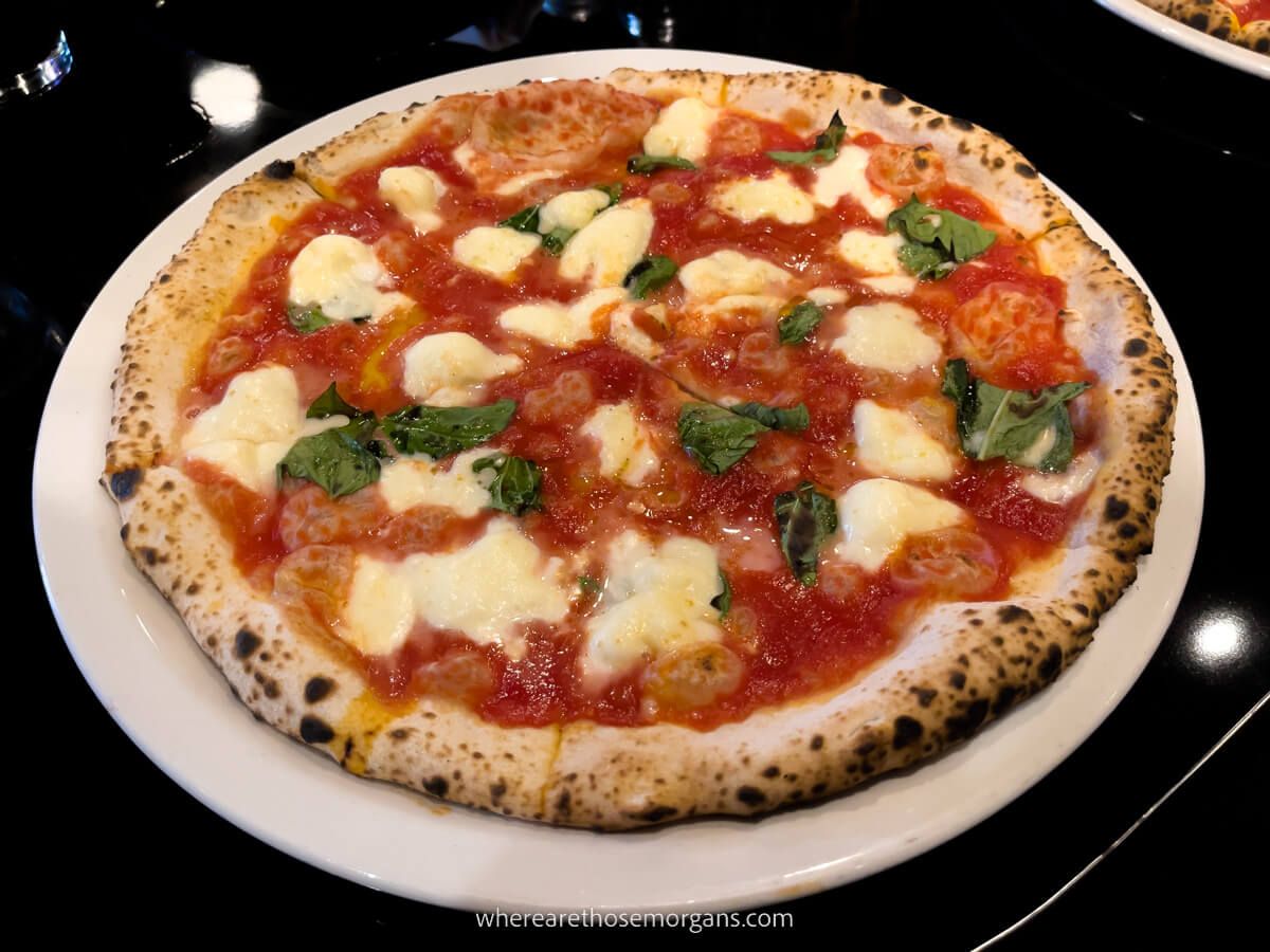 Neapolitan pizza margarita on a white plate