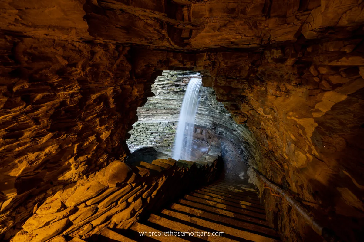 Cascade Cavern waterfall through a cave with orange light