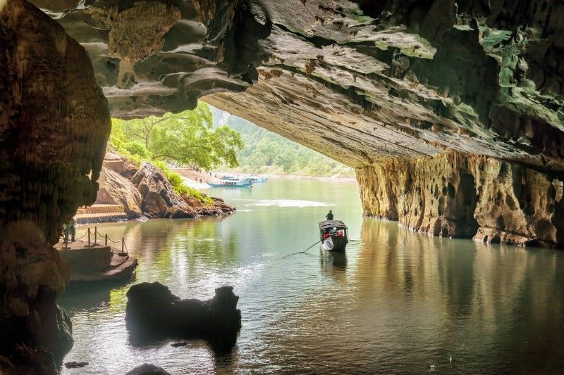 A boat making its way through the entrance to the Phong Nha Cave