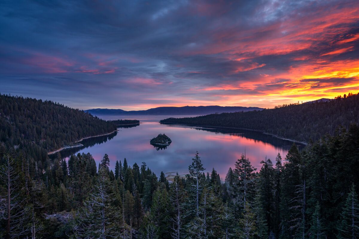 Sunrise over Emerald Bay in Lake Tahoe stunning colors lighting up the clouds