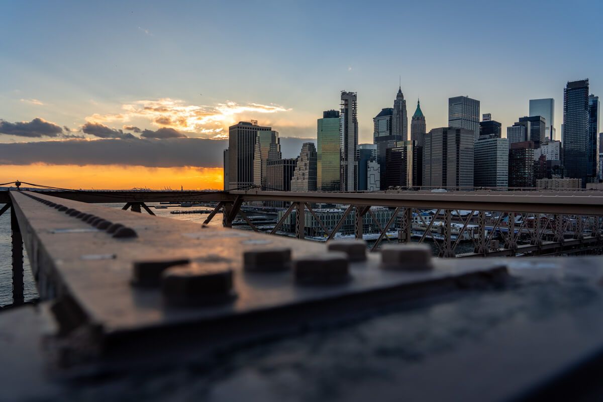 New York City skyline at sunset as seen from Brooklyn Bridge