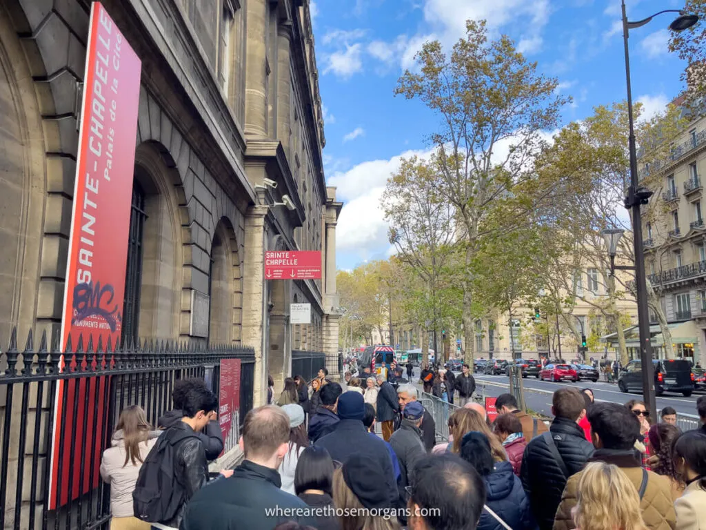 A long line of people waiting for entry into Sainte-Chapelle, a popular attraction on a Paris attraction pass