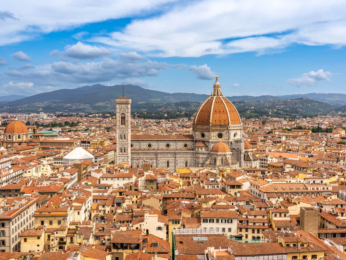 Cityscape photo of Florence Italy taken from elevation so lots of buildings and rooftops are visible