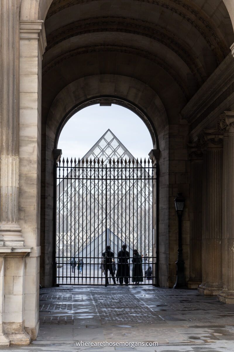 Side view of the large glass pyramid at the Louvre