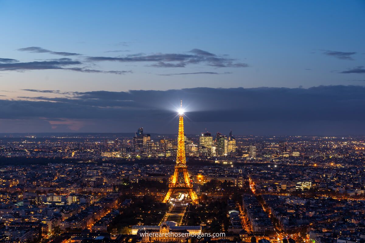 Eiffel Tower and Paris city view with lights on at night