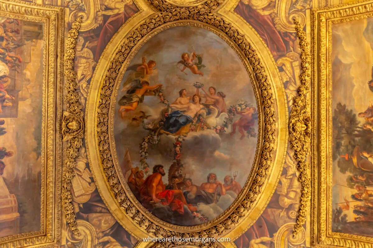 Large painting on the ceiling of a room at versailles