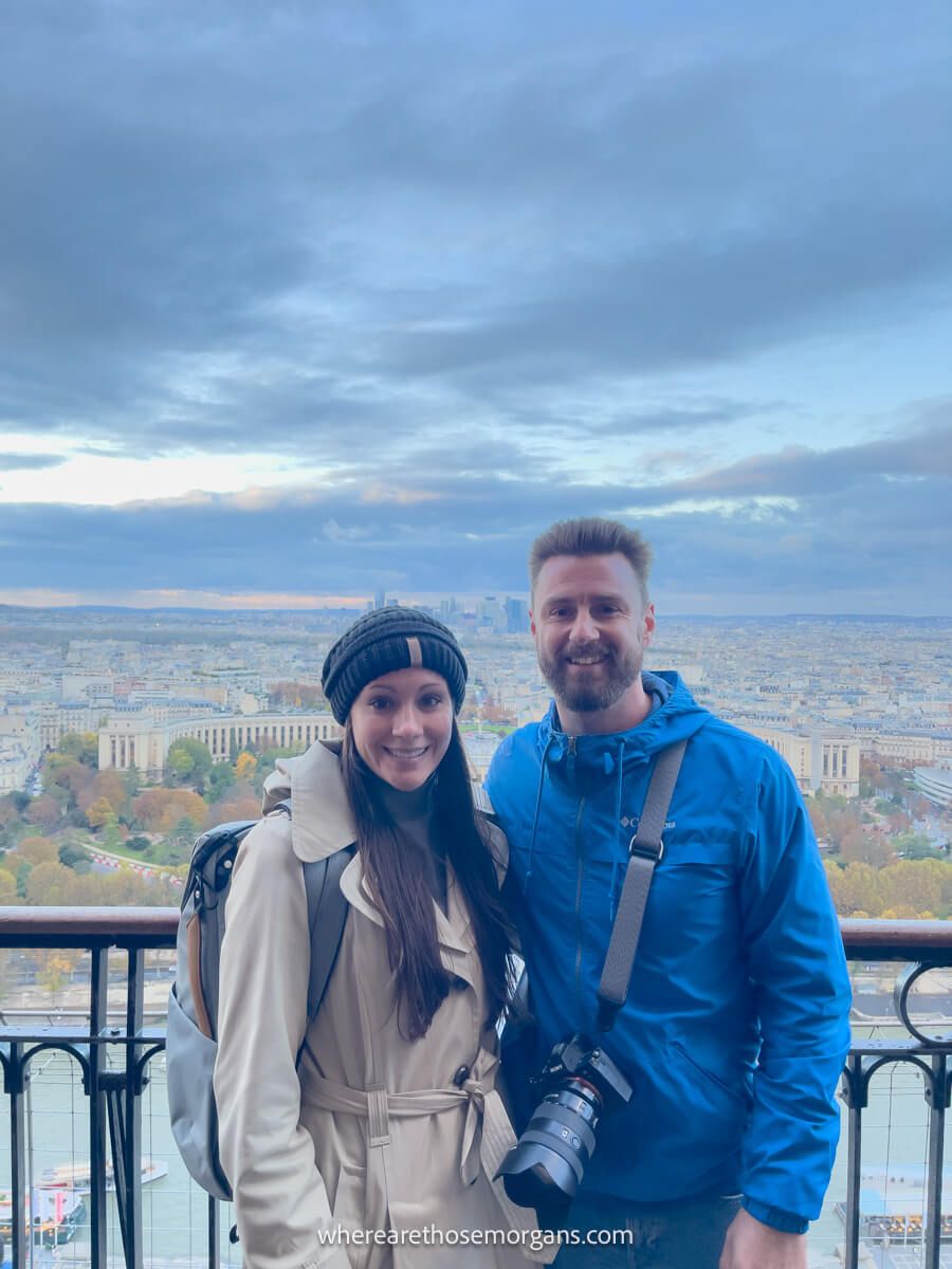 Two people visiting the Eiffel Tower in Paris France