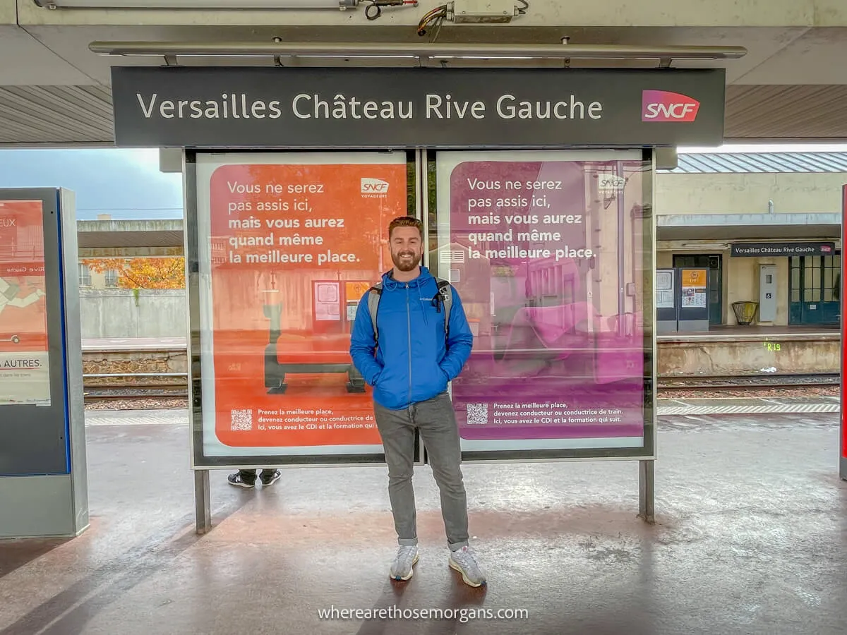 Man standing on the platform at Versailles Chateau Rive Gauche train station