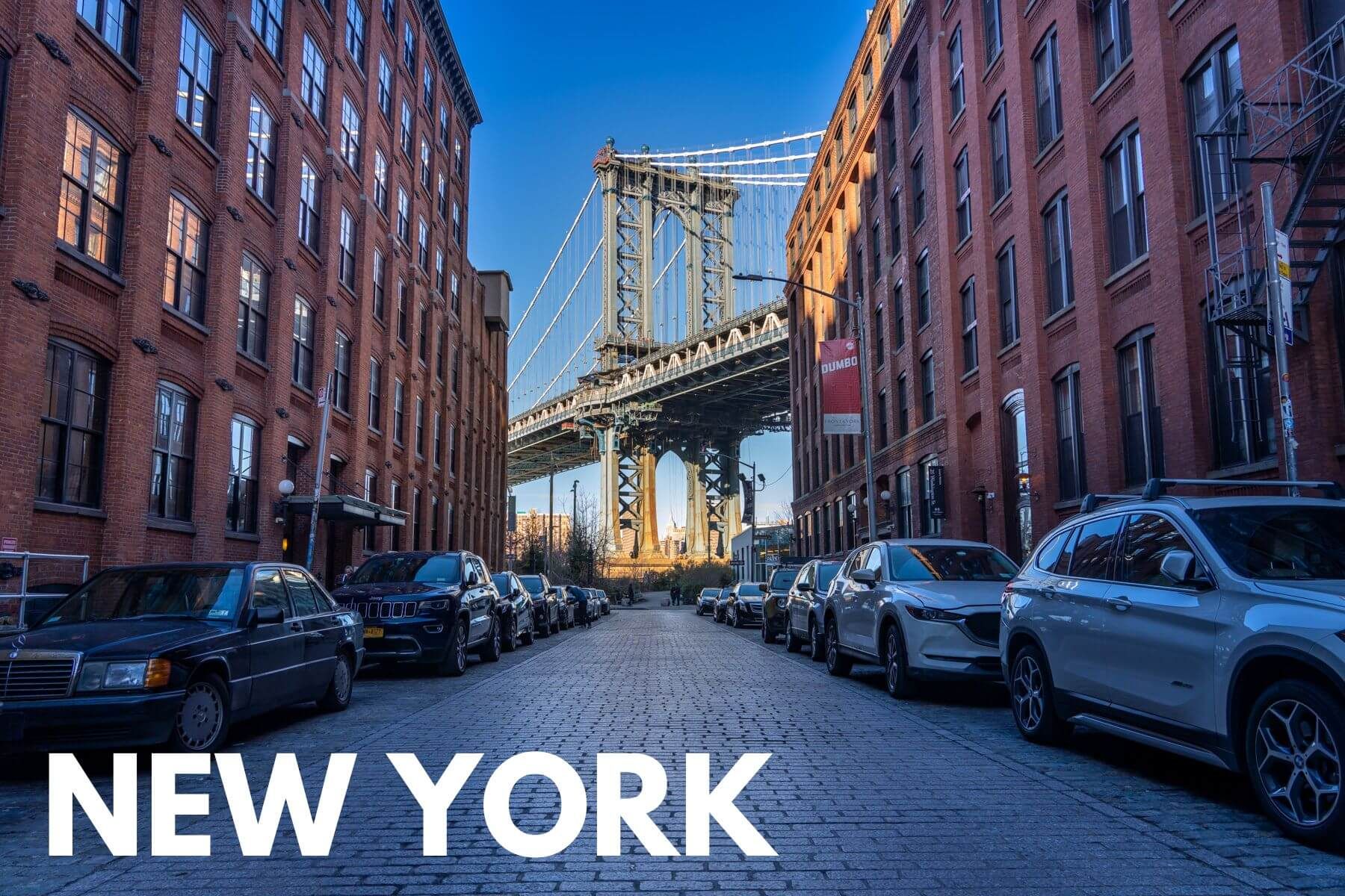 Photo of the Manhattan Bridge in between tall rows of buildings in Brooklyn with the word New York overlaid