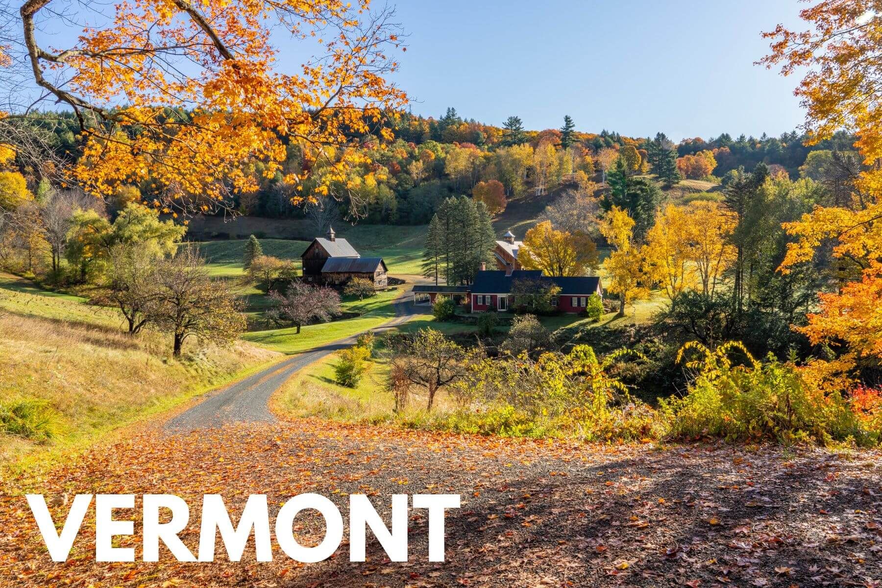 Photo of a farmstead in Woodstock VT surrounded by vibrant fall foliage colors and the word Vermont overlaid