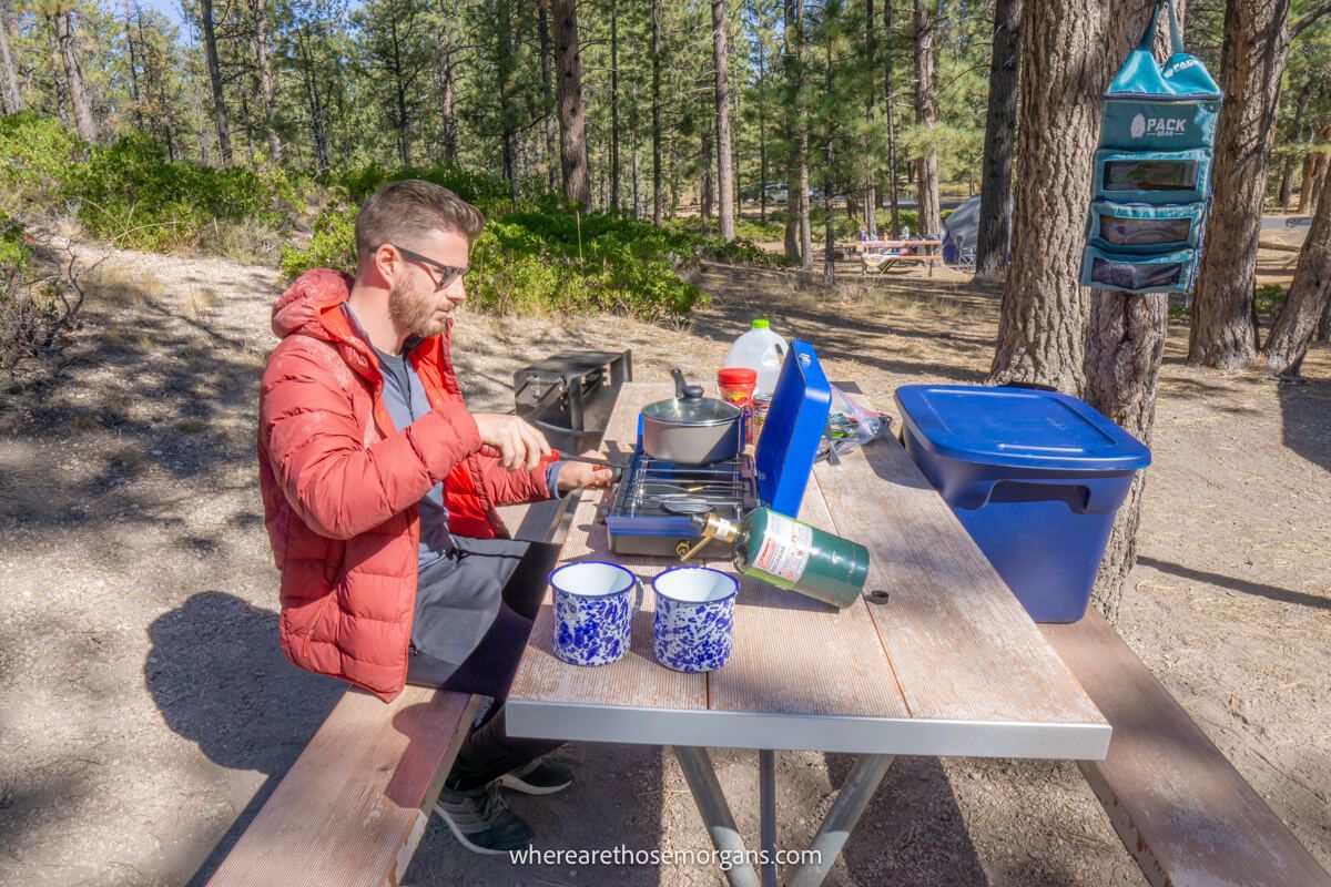 Man making food during a road trip in Bryce Canyon National Park