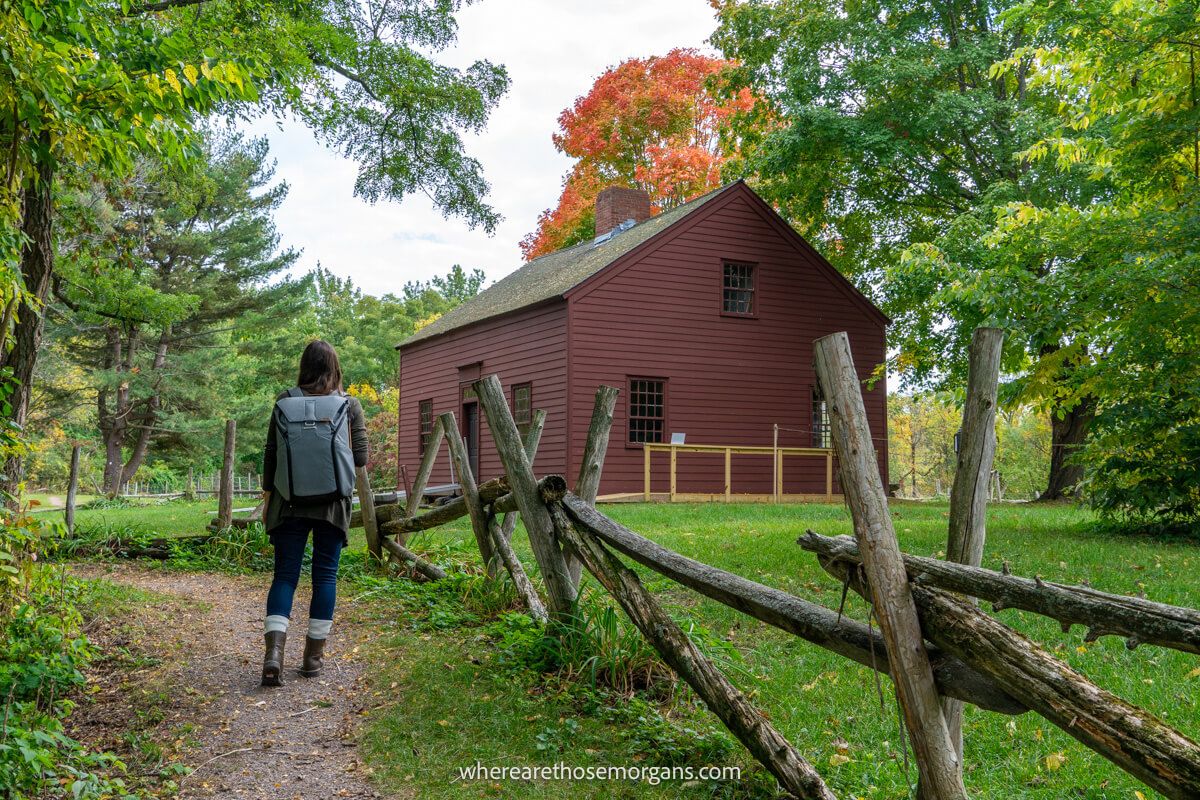 Woman walking along a path at the Ethan Allen Homestead