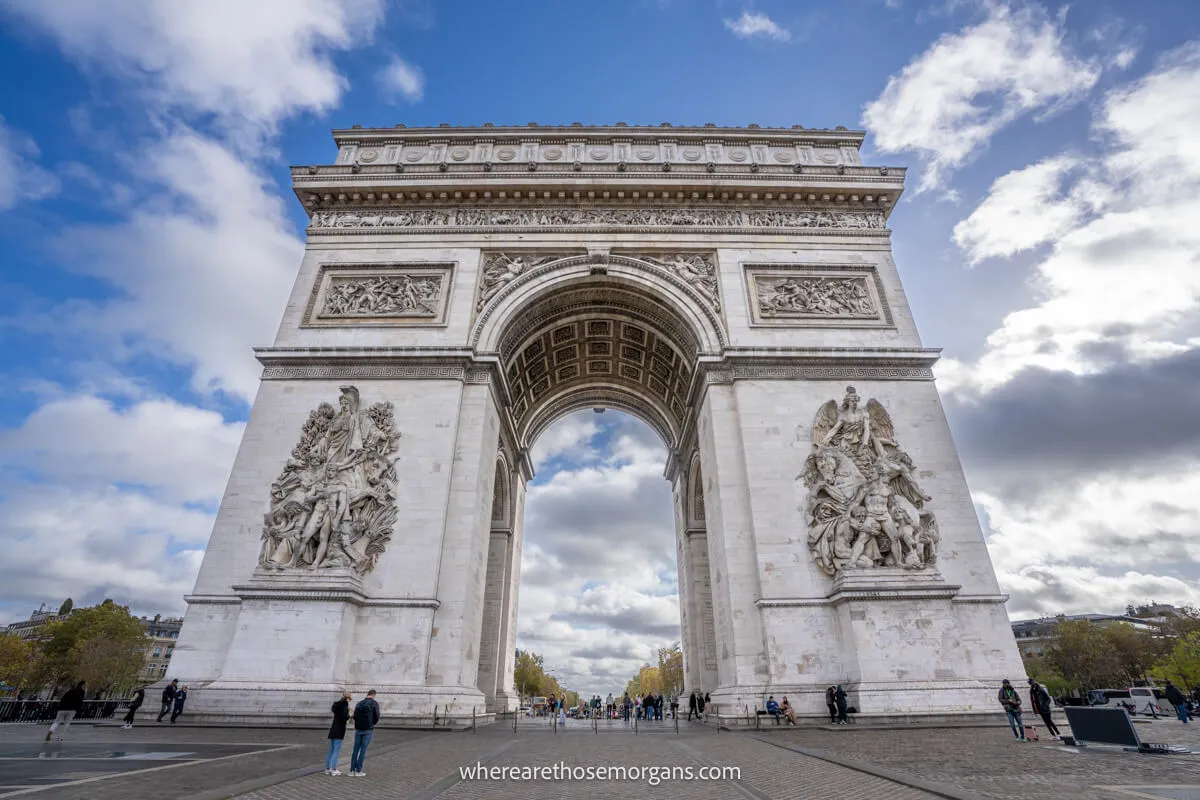 Exterior view of Arc De Triomphe on a beautiful day in Paris