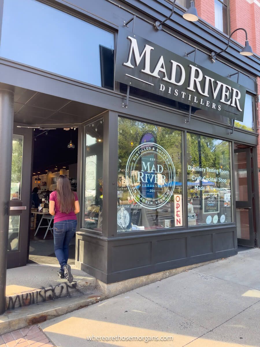 Woman walking into the Mad River Distillery