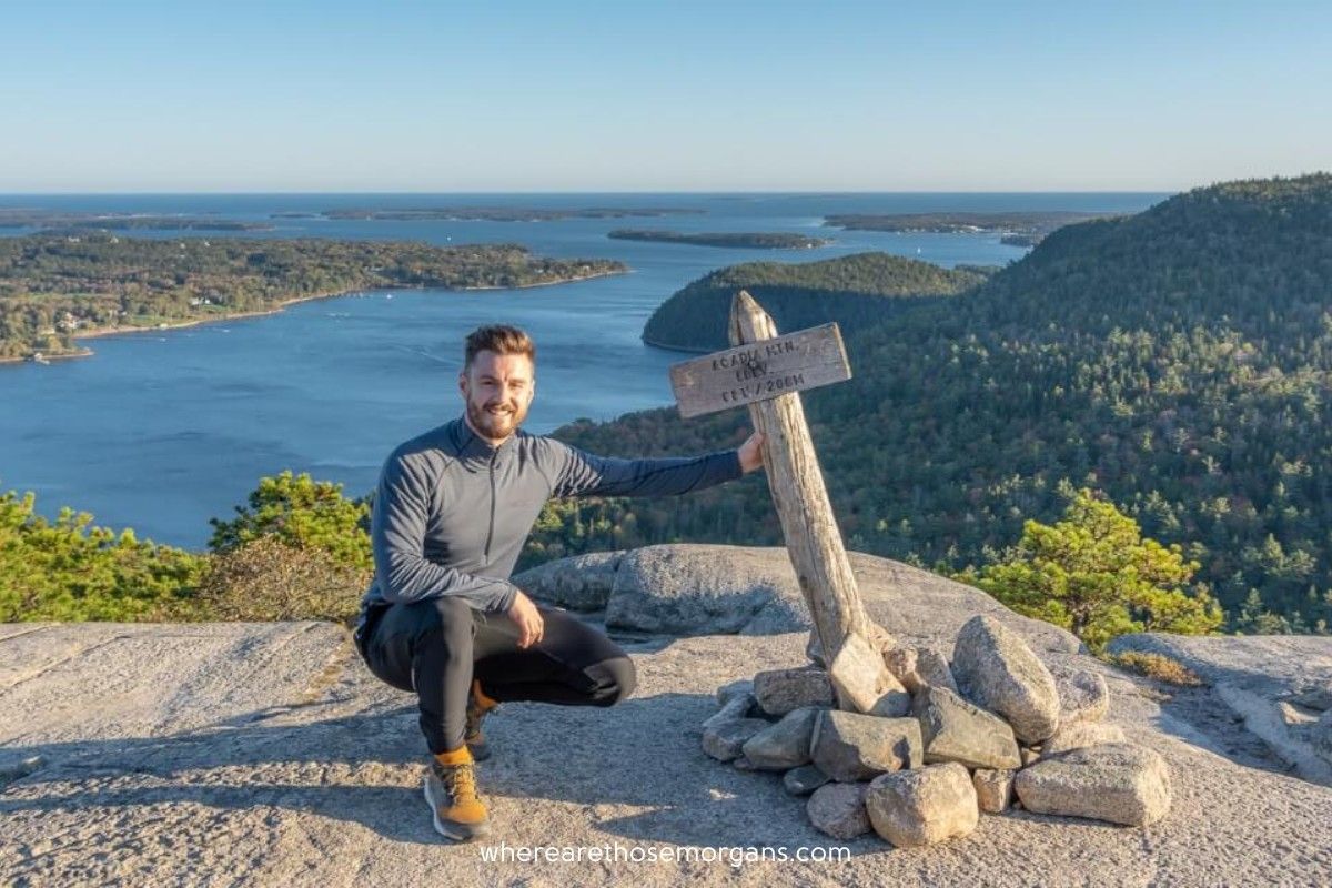 Man at the summit of Acadia Mountain