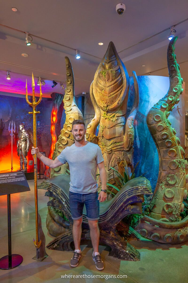 Man holding the Trident of Neptune from Aquaman