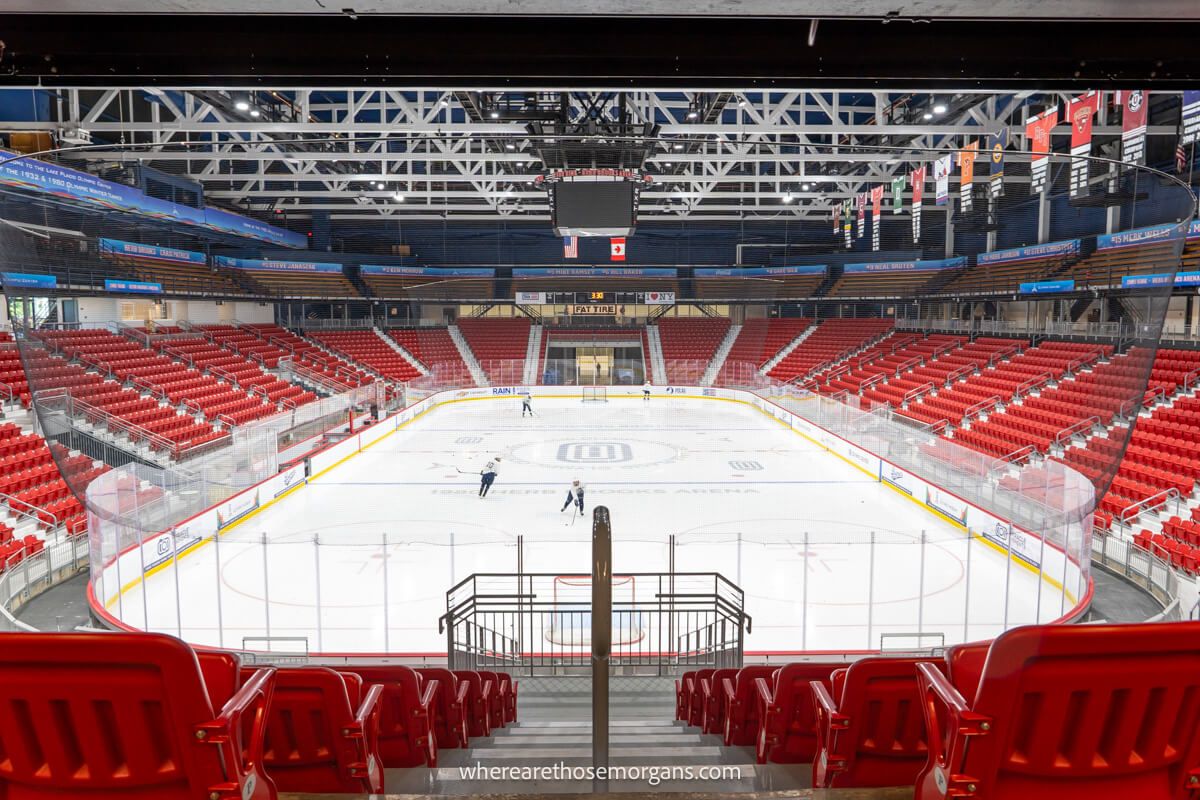 Hockey players practicing on a large ice rink