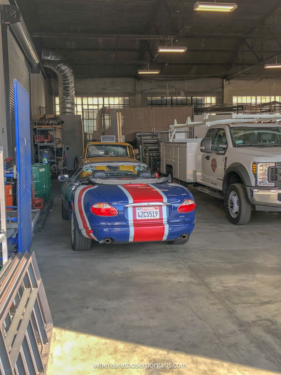 Phoebe's taxi from Friends and Austin Power's Shaguar parked in a garage