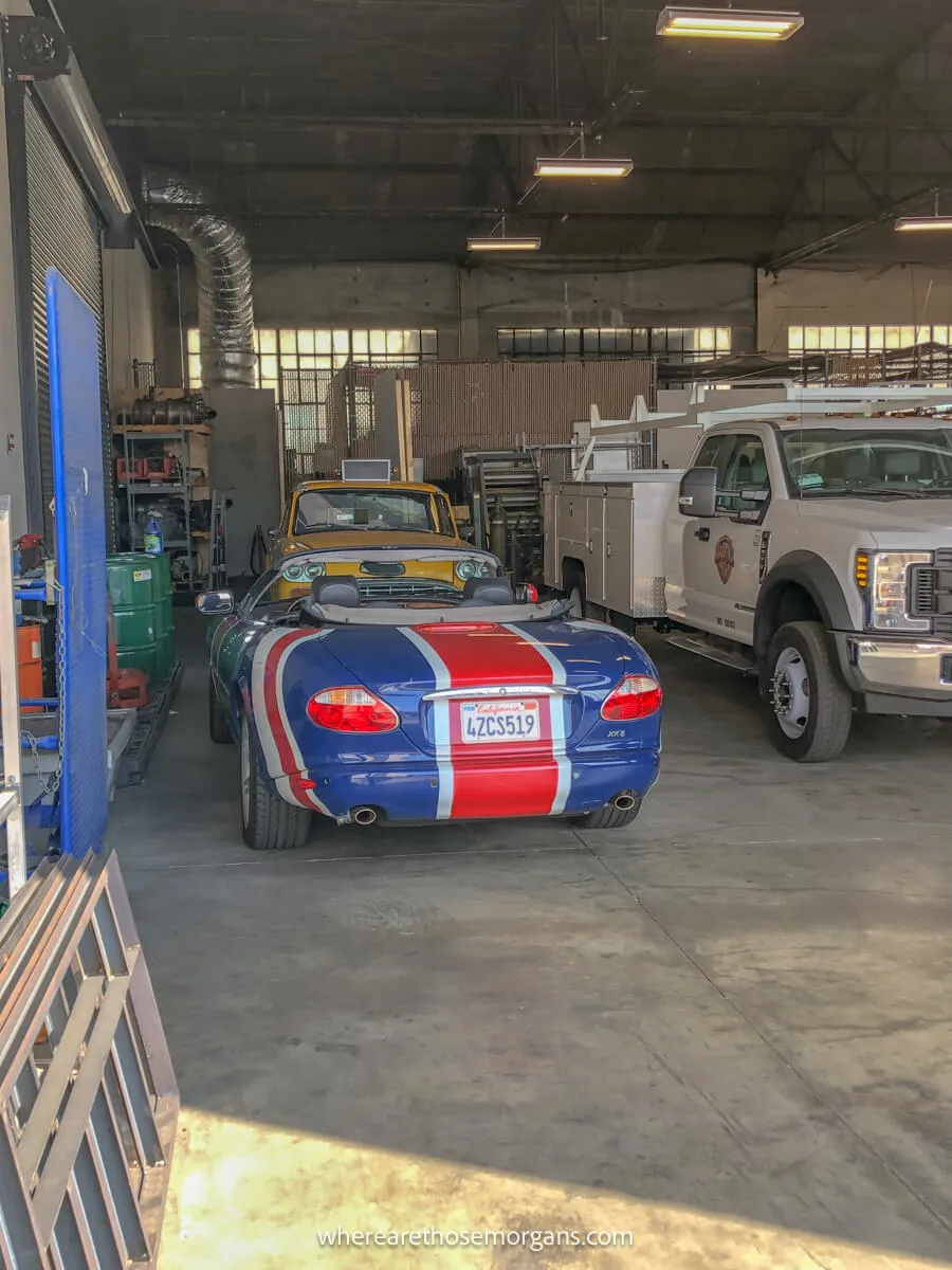 Phoebe's taxi from Friends and Austin Power's Shaguar parked in a garage