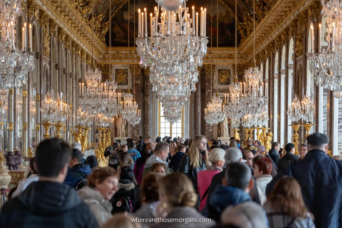 Hundreds of people trying to walk through the Hall of Mirrors in the Palace of Versailles