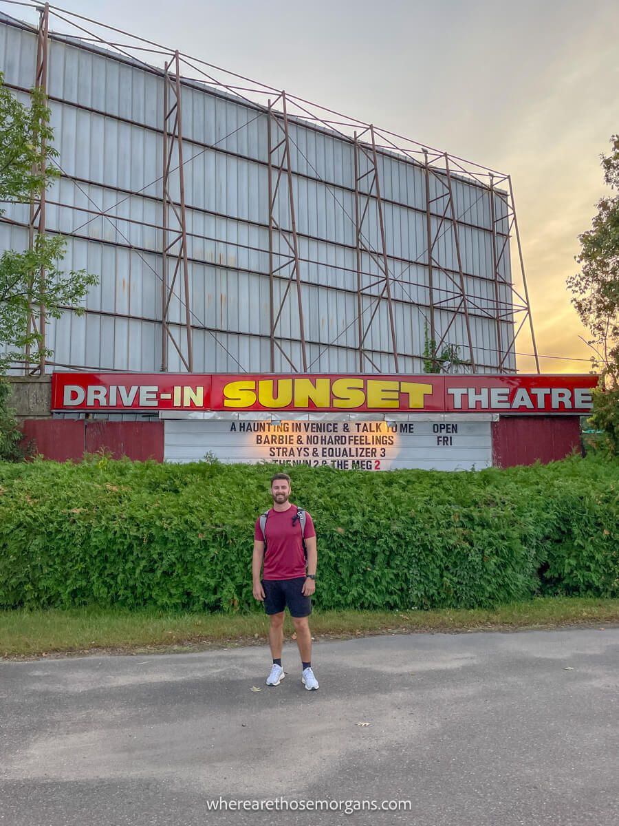 Man standing outside of sunset theater in Vermont