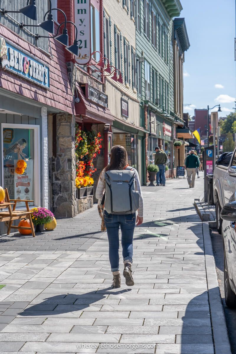 Woman walking down Main Street in the quaint village of Lake Placid