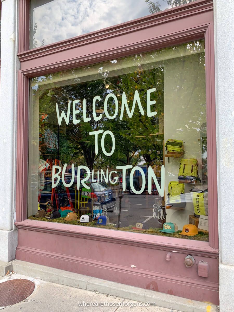 A welcome to Burlington, Vermont sign on a window in town