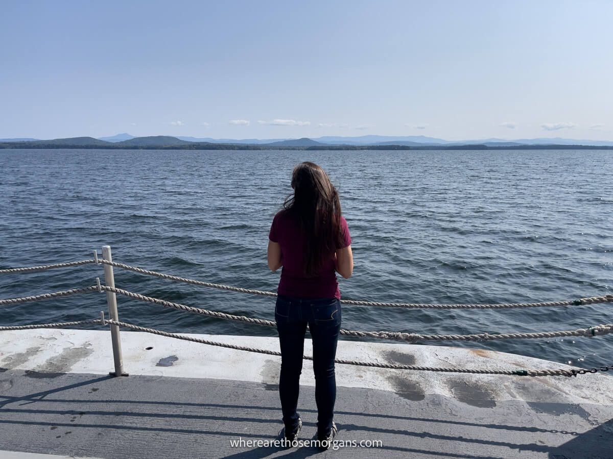 Person crossing Lake Champlain on a ferry looking out at the views