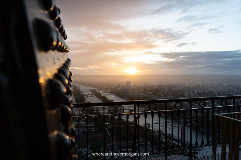 Sunset view from the Eiffel Tower 2nd floor with sunlight reflecting on steel