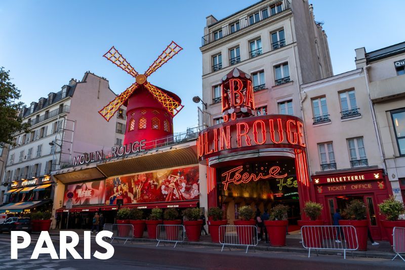 Photo of Moulin Rouge windmill facade from outside at dusk with the word Paris overlaid