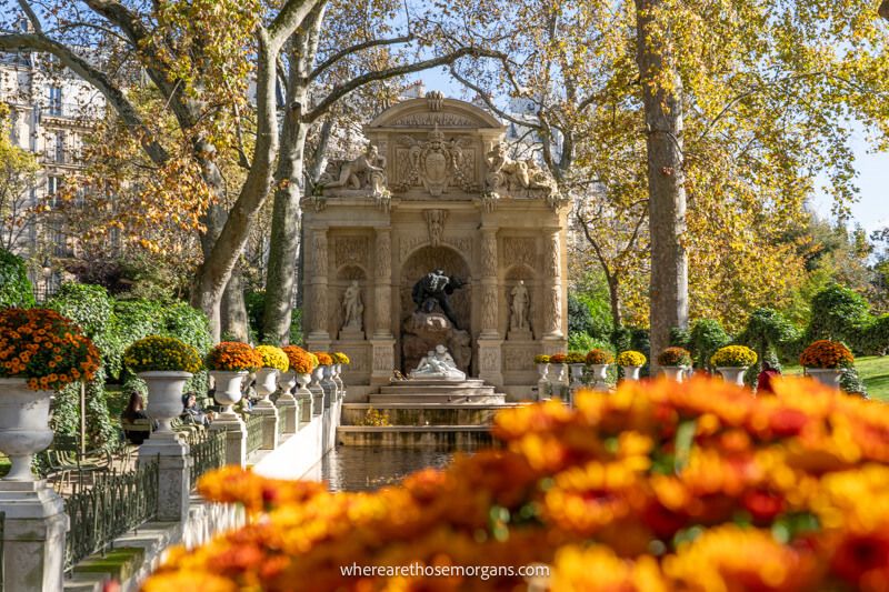 Flowers and water feature leading to a fountain in the Luxembourg Garden in Paris France