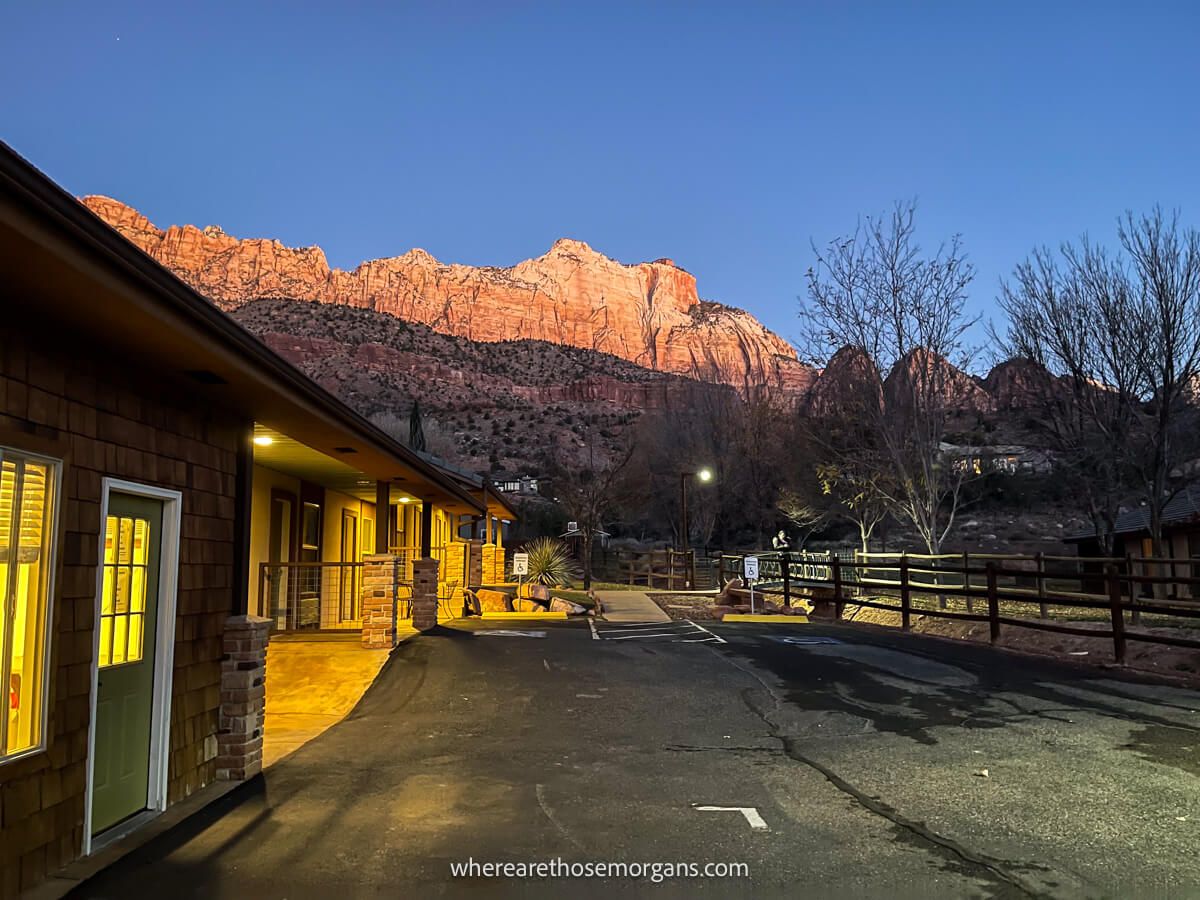 Sunrise from a hotel in Springdale Utah with orange canyon walls glowing at dawn