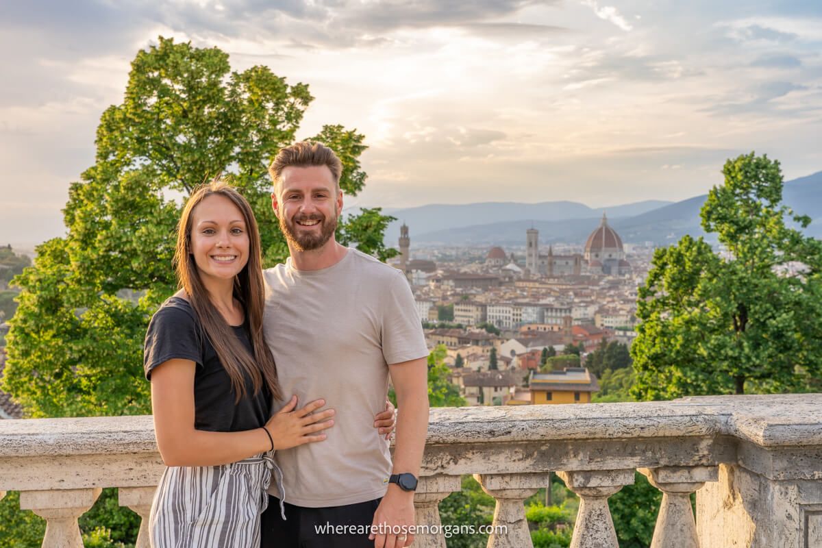 Photo of a couple standing together at sunset overlooking Florence in Italy