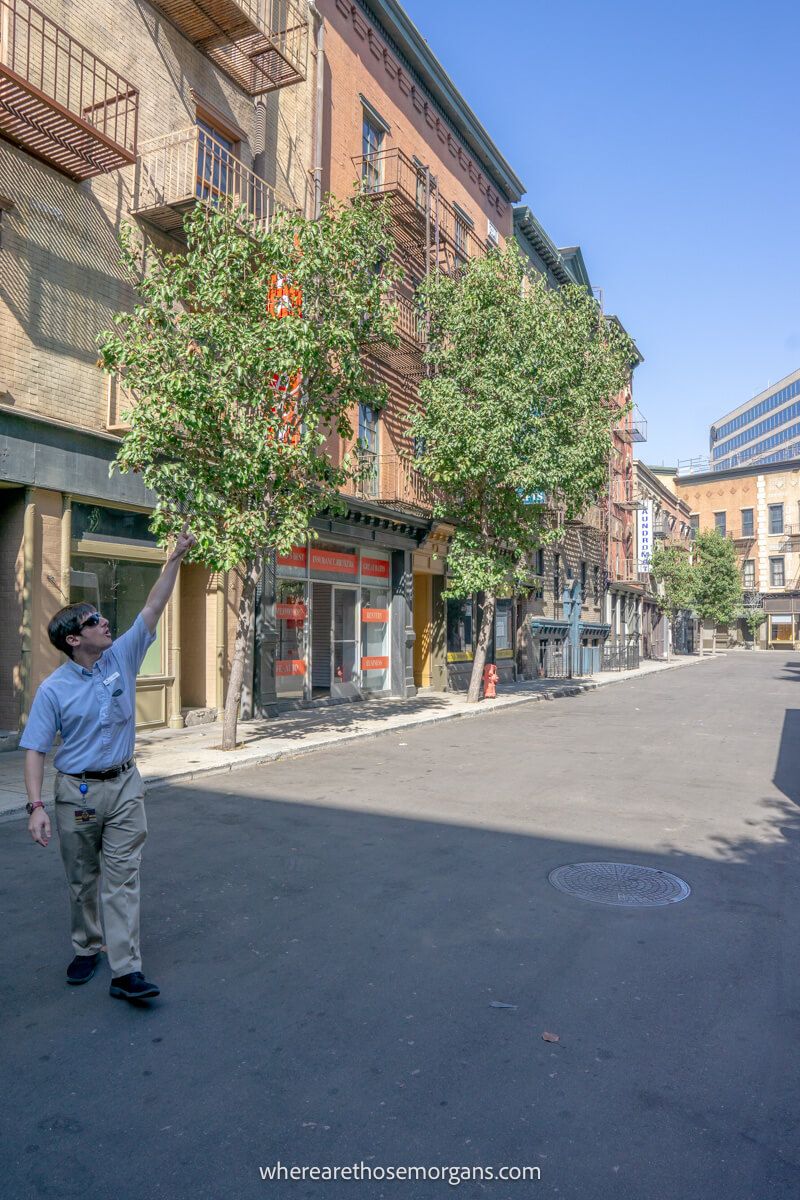 Tour guide pointing out highlights on a movie set at Warner bros studio