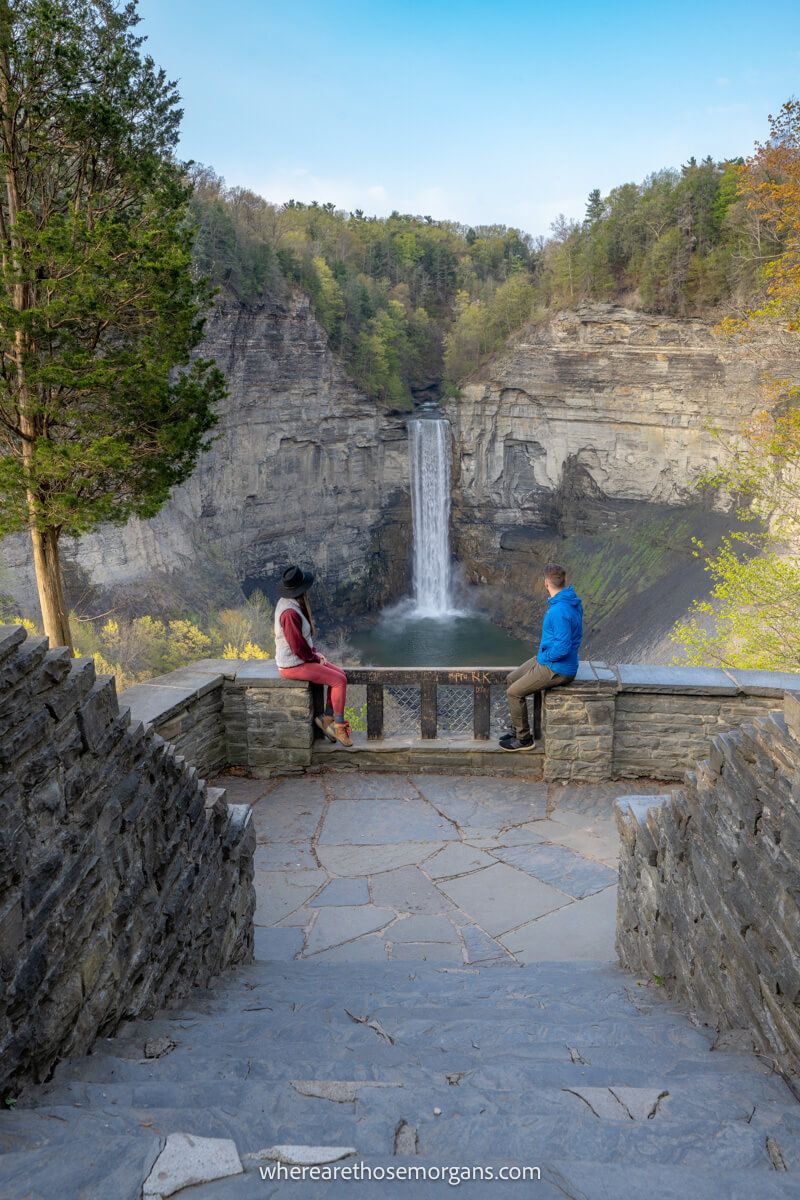 Two hikers looking out at Taughannock Falls