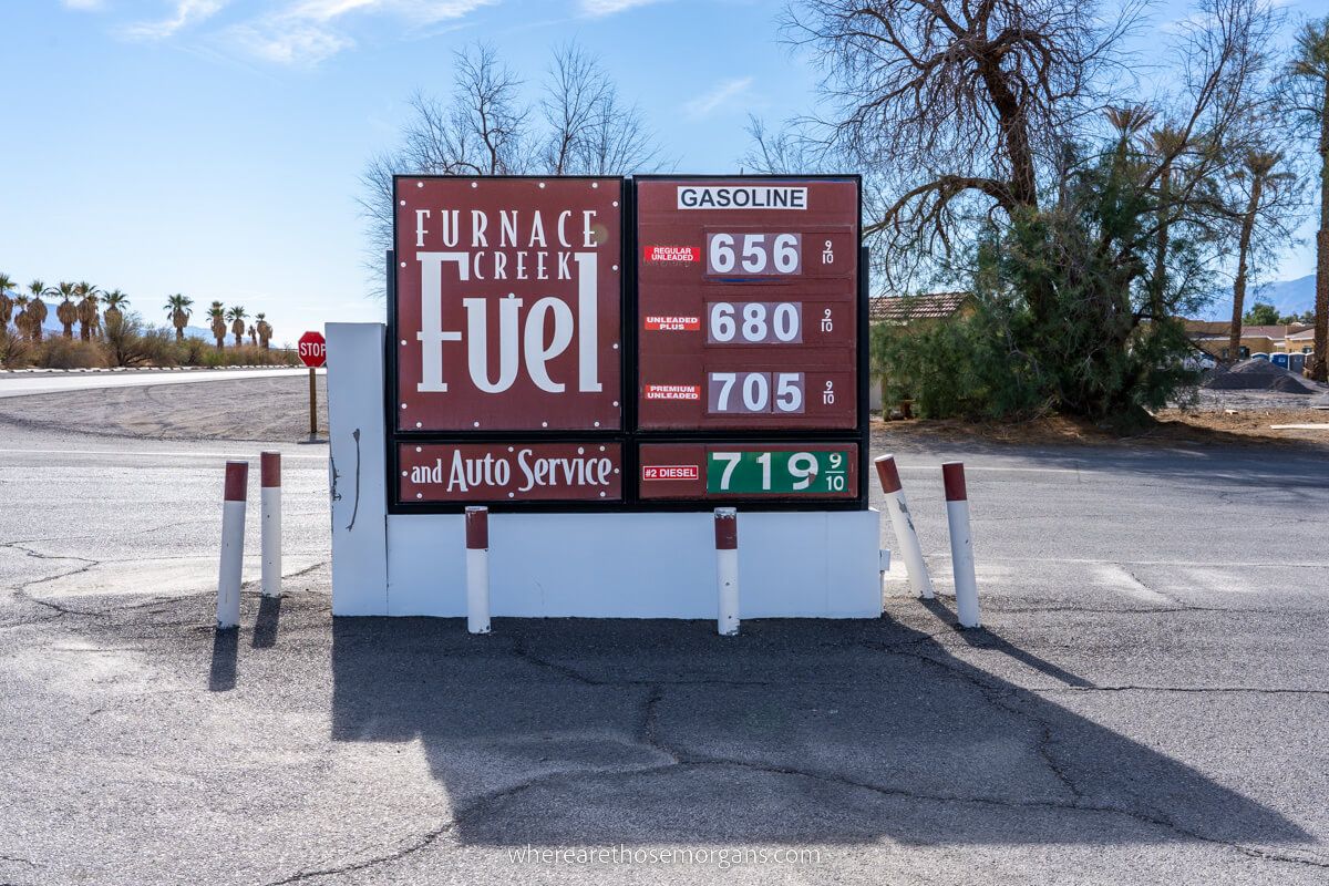 Board showing incredibly high fuel prices at Furnace Creek in Death Valley National Park on a sunny day