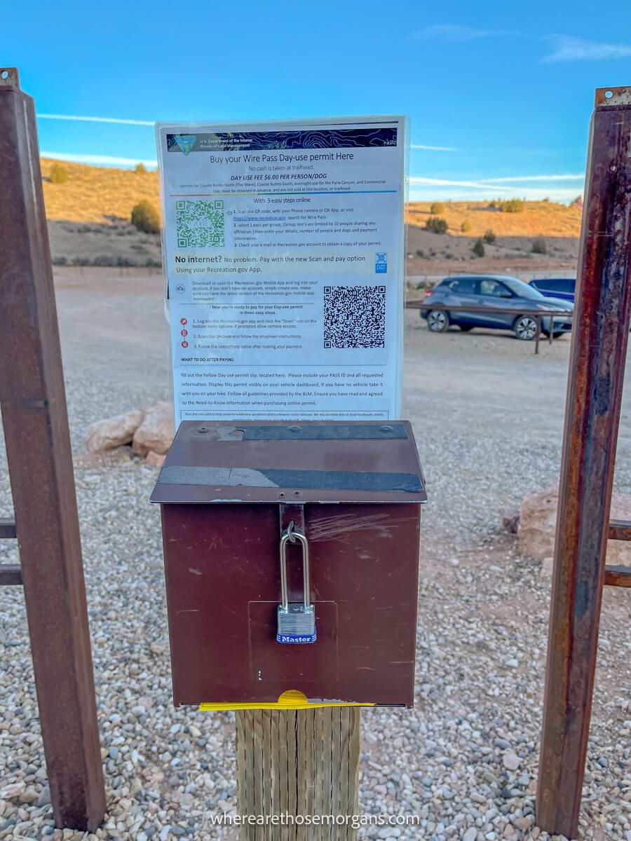 Metal box on a wooden pole with day use hiking permit information